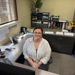 Smiling woman at desk