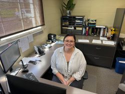 Smiling woman at desk